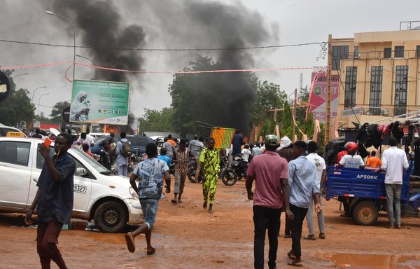 Supporters of the Nigerien putschists attack the headquarters of President Mohamed Bazoum's Nigerien Party for Democracy and Socialism (PNDS) in Niamey, Niger, on July 27. [AFP]