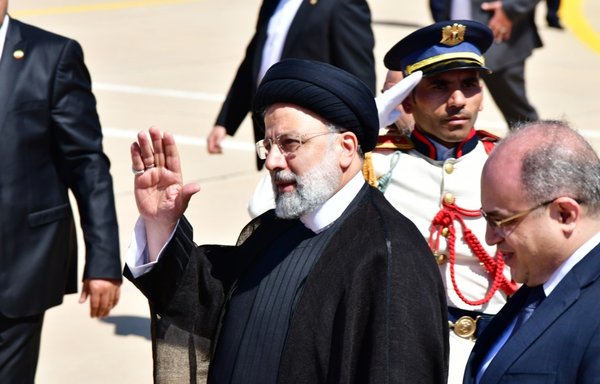 Iranian President Ebrahim Raisi waves during a welcome ceremony at Damascus International Airport on May 3. [AFP]