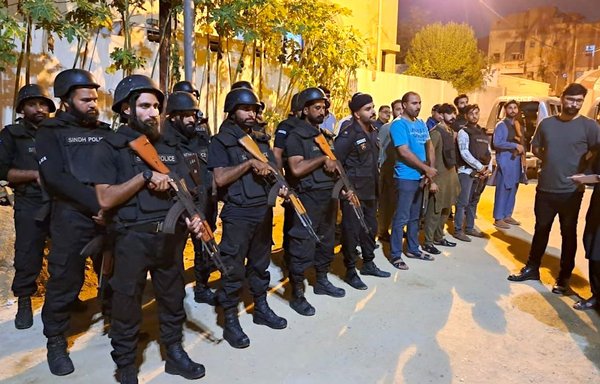 Pakistani police gather August 8 at the Sindh Counter Terrorism Department office in Karachi. [Zarak Khan]